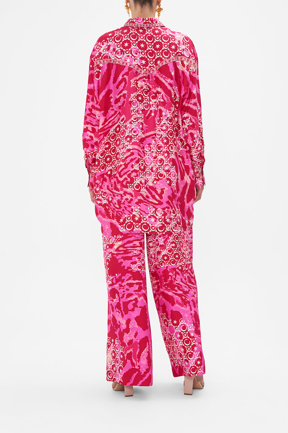 Back view of model wearing CAMILLA silk shirt in Song Of Sacrifice print