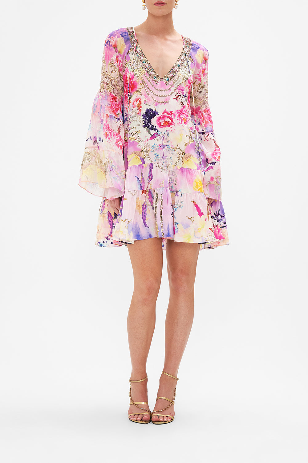 Front view of model wearing CAMILLA floral mini dress in Sonic Symphonies print