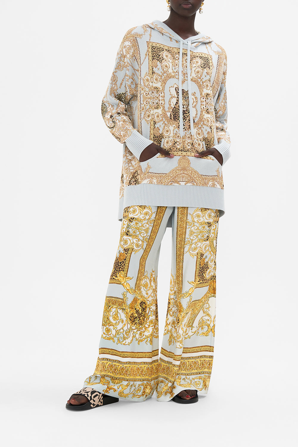 Front view of model wearing CAMILLA knit hoodie in Palazzo Pride print