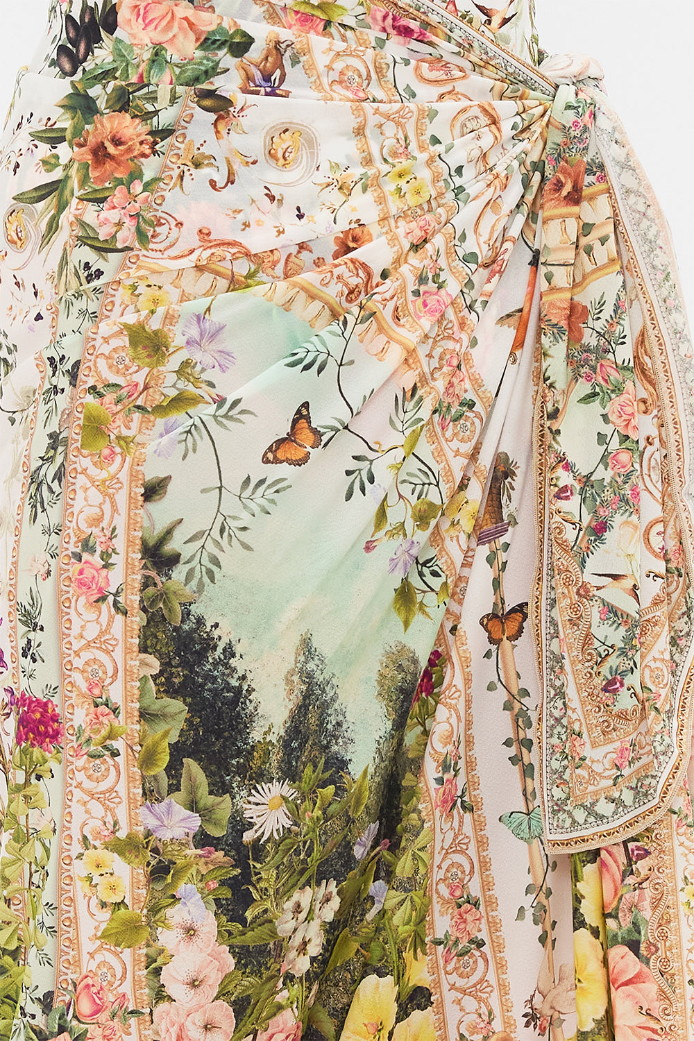 Detail view of model wearing CAMILLA resortwear long sarong in Renaissance Romance print