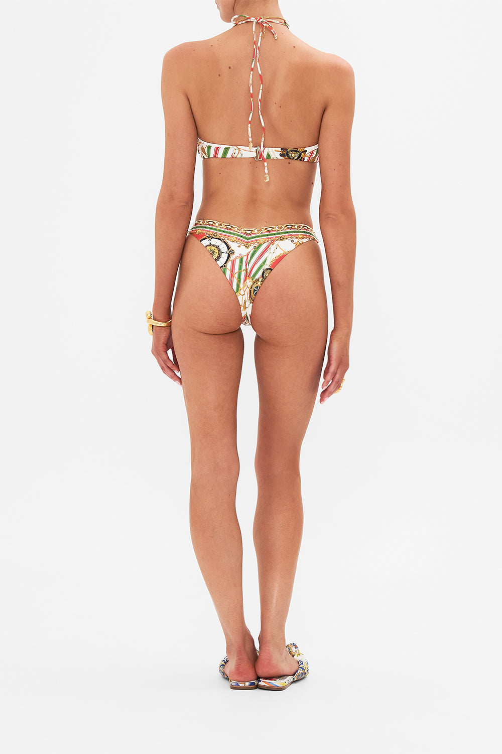 Back view of model wearing CAMILLA designer bikini bottom in Saluti Summertime print