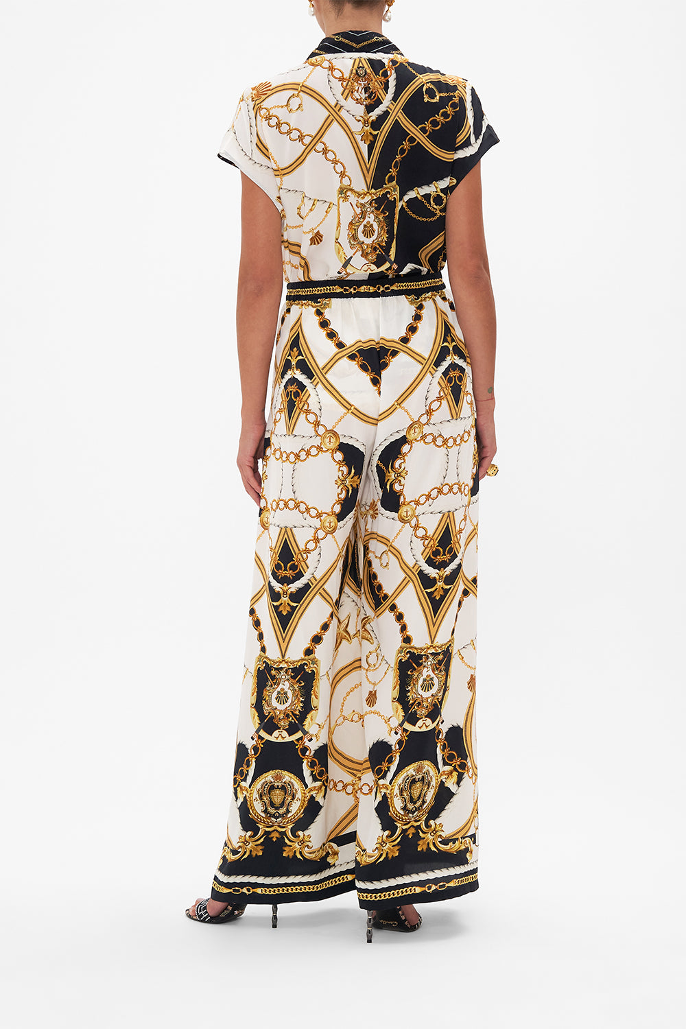 Back view of model wearing silk shirt in Coast To Coast print