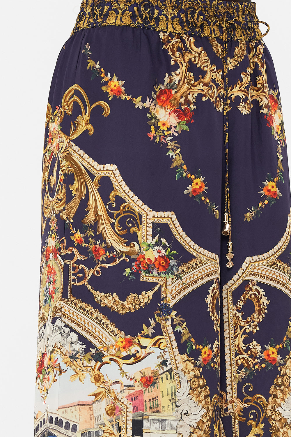 Detail view of model wearing CAMILLA silk pants in Venice Vignette print