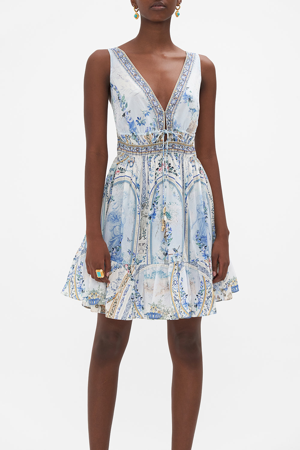 Crop view of model wearing CAMILLA silk mini dress in Season of tHe Siren print