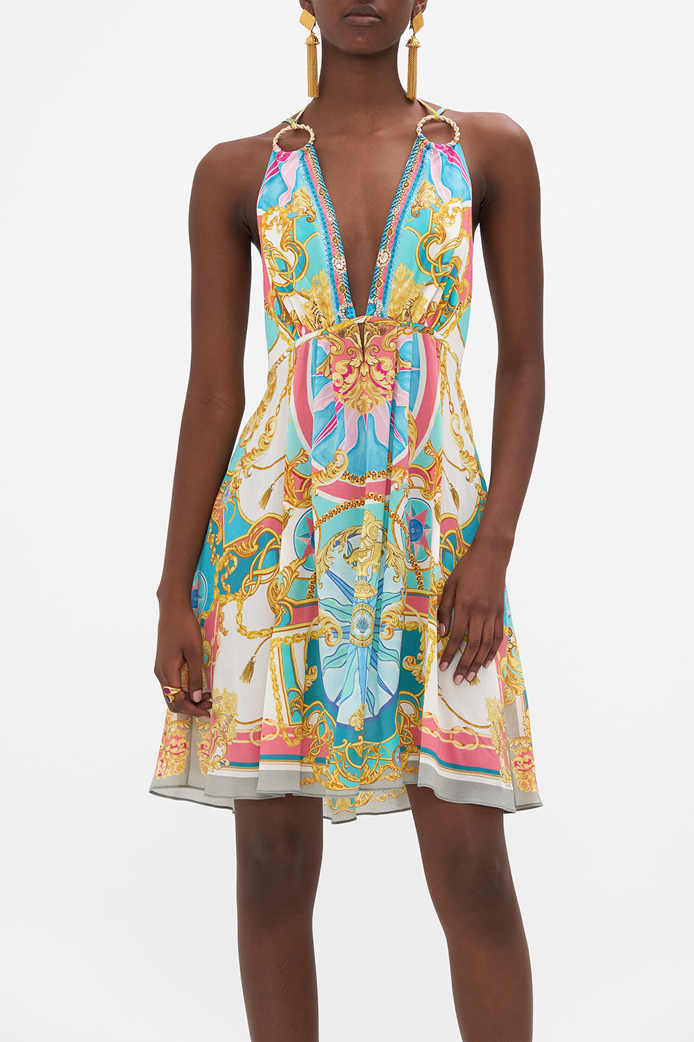 Crop view of model wearing CAMILLA silk mini dress in Sail Away With Me print