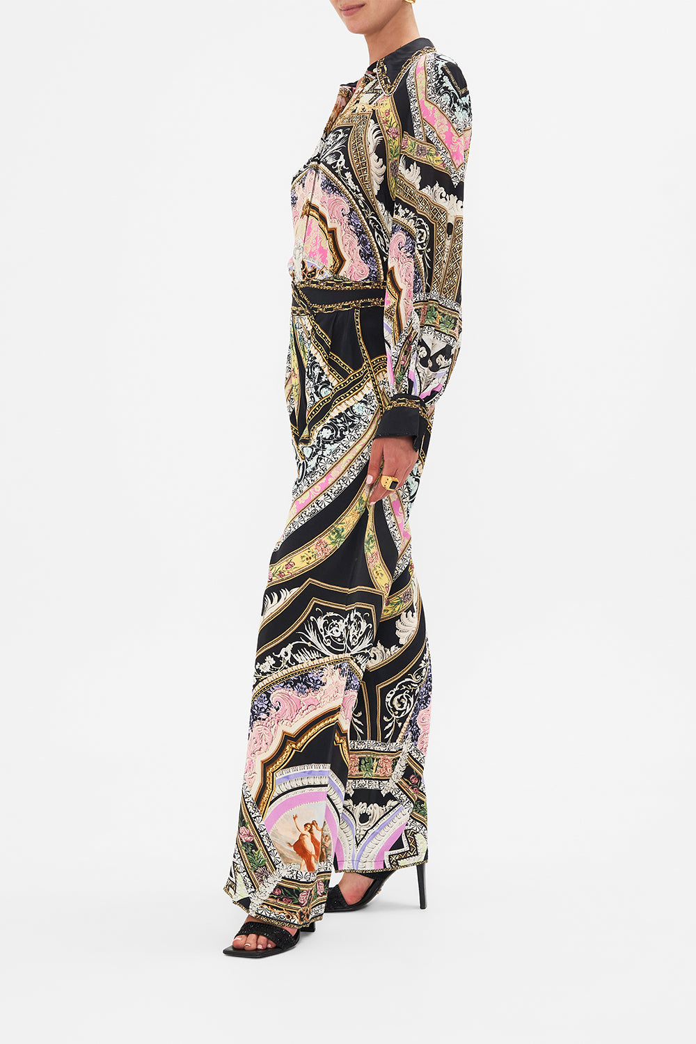 Crop view of model wearing CAMILLA flared pant in Florence Field Day print