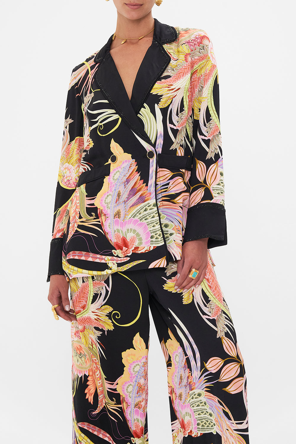 Crop view of model wearing CAMILLA deisgner jacket in lady of The Moon Print