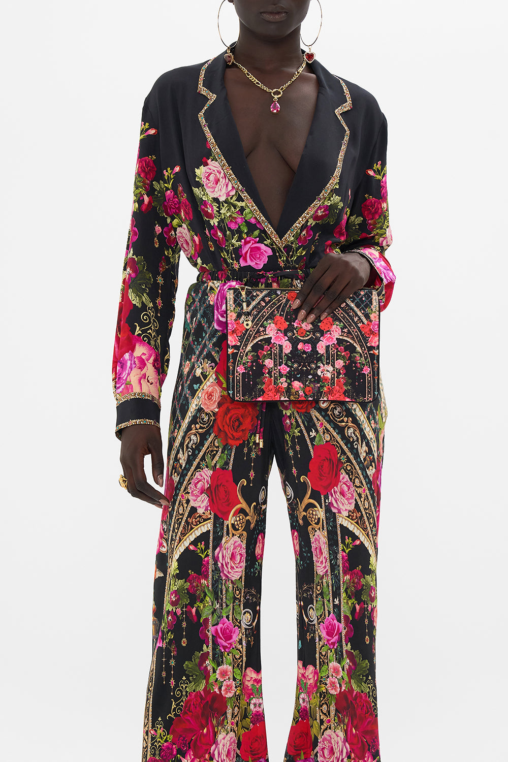 Product view of CAMILLA designer clutch bag in Reservation For Love print