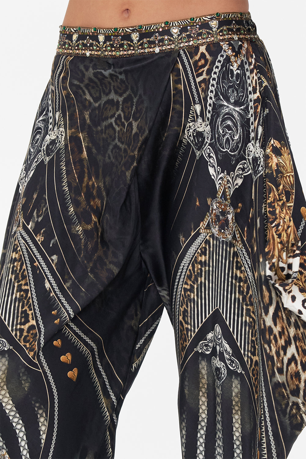 Detail view of model wearing CAMILLA drapey silk pants in Chaos In The Cosmos animal print