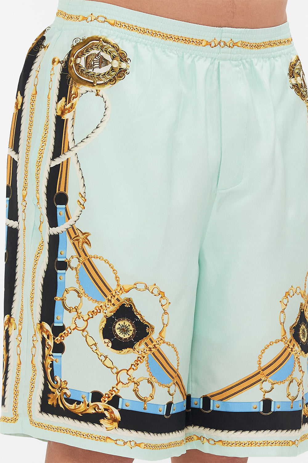 Detail view of model wearing Hotel Franks By CAMILLA mens walk short in Sea Charm print