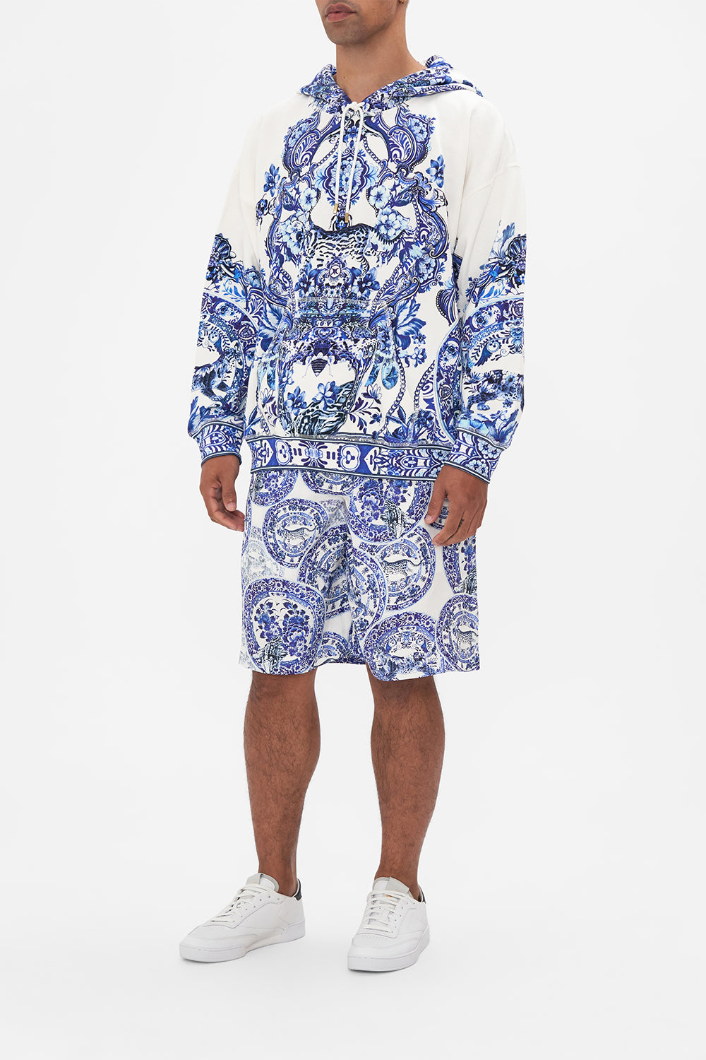 Side view of model wearing Hotel Franks by CAMILLA mens oversized hoodie in Glaze and Graze print