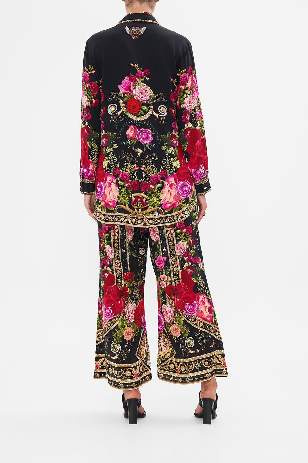 Back view of model wearing CAMILLA silk jacket in Reservation For Love print