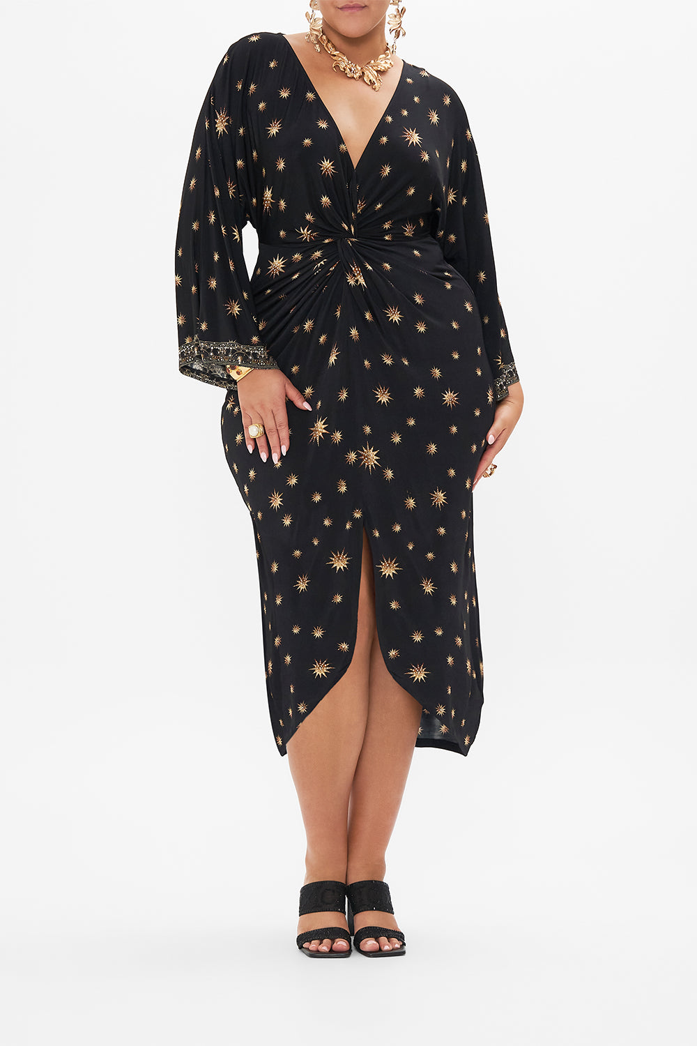 Front view of curvy model wearing CAMILLA plus size black midi dress in Soul Of A Star Gazer print
