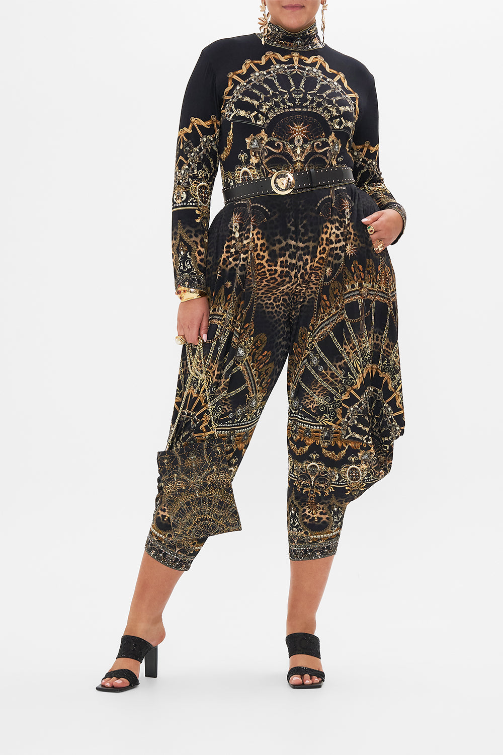 Front view of curvy model wearing CAMILLA plus size black turtleneck top in Masked At Moonlight print