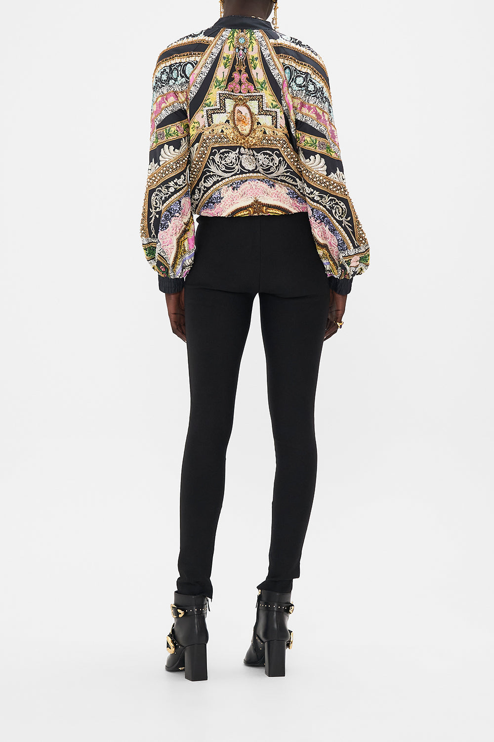 Back view of model wearing CAMILLA silk bomber jacket in Florence Field Day Print