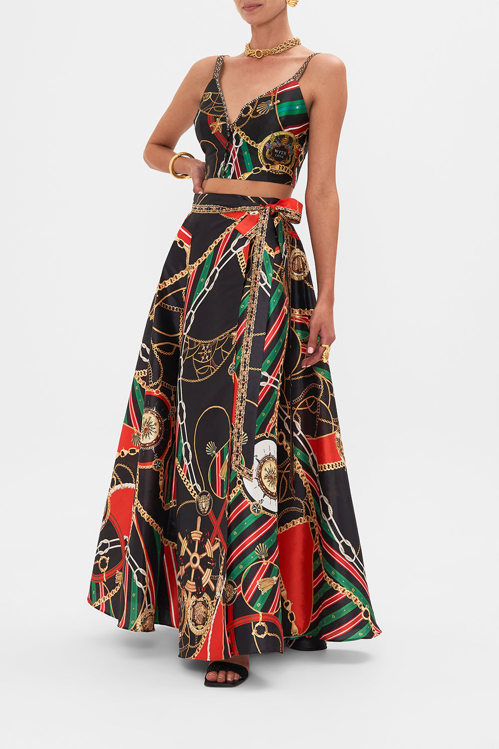 Side view of model wearing CAMILLA designer flared pants in Soul of A Stargazer print