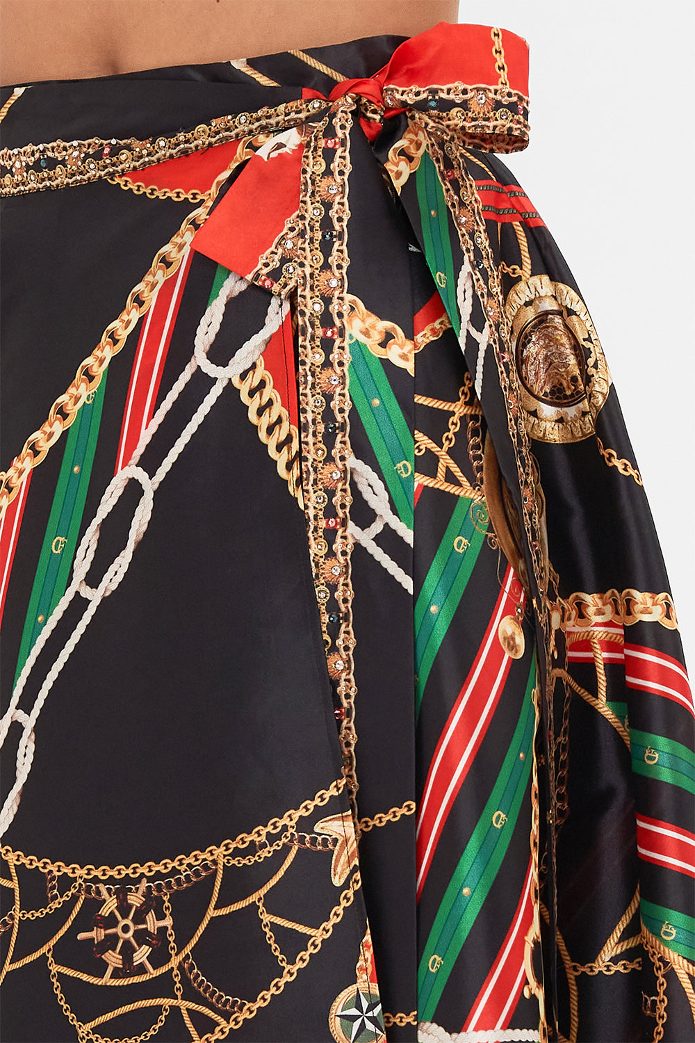 Detail view of model wearing CAMILLA designer flared pants in Soul of A Stargazer print