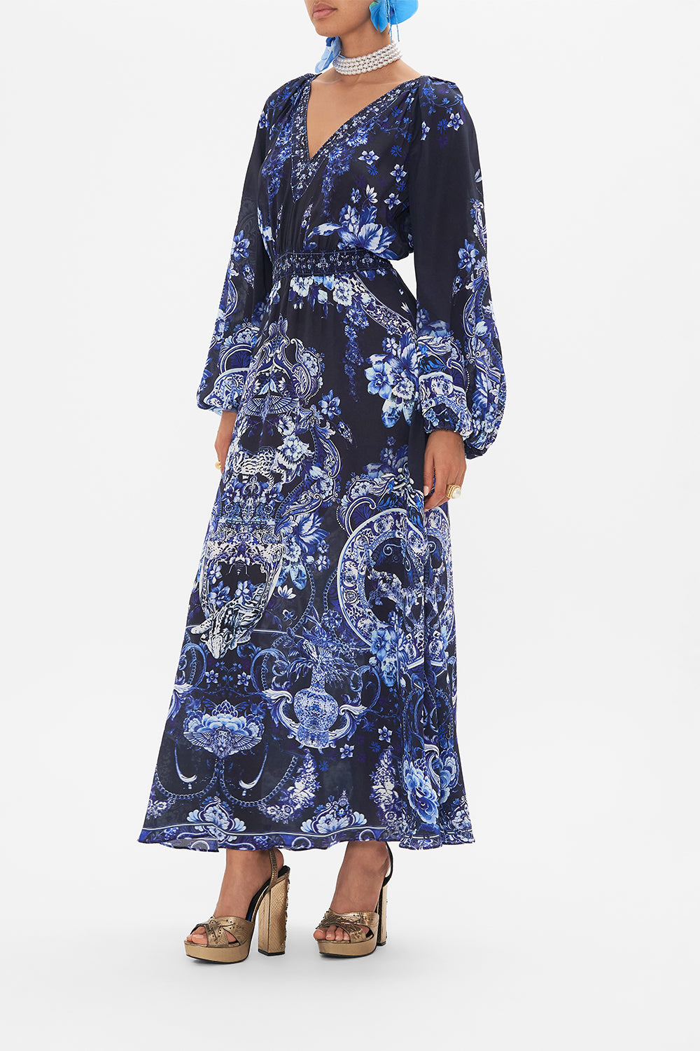 Side view of model wearing CAMILLA silk dress in Delft Dynasty print