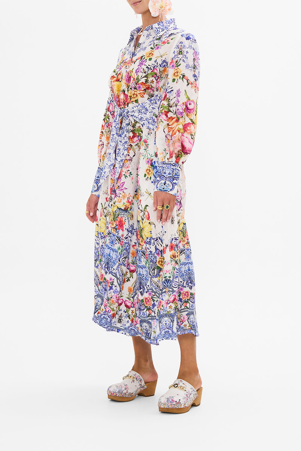 Side view of model wearing CAMILLA silk shirt dress in Dutch Is Life print