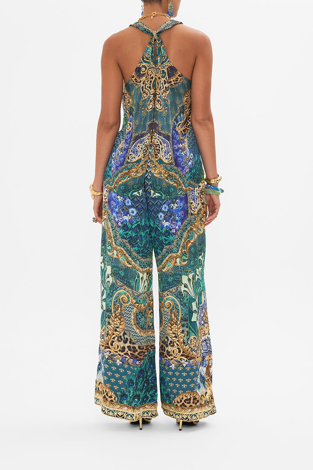 Back view of model wearing CAMILLA silk top in Fan Dance print