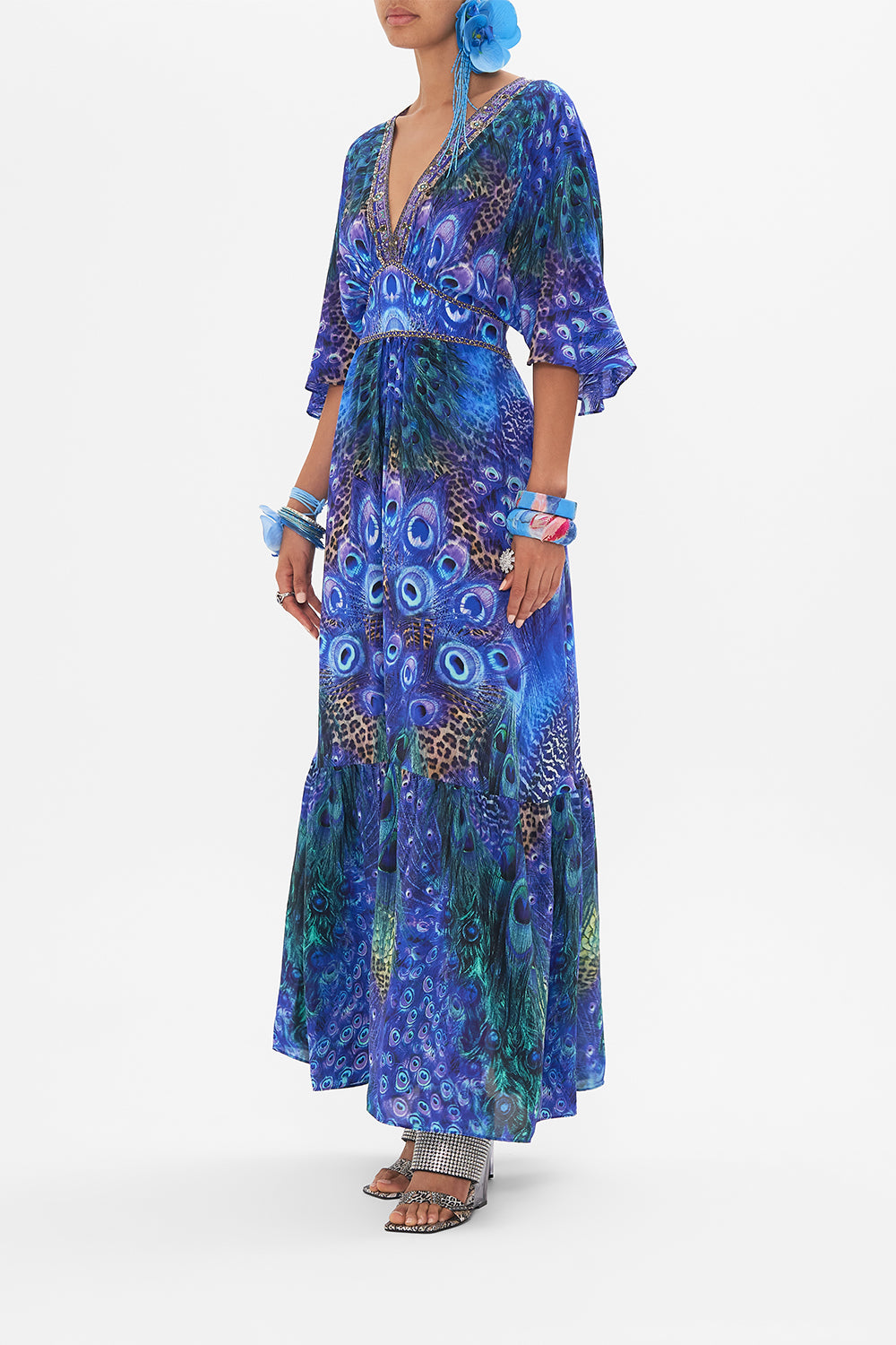 Side view of model wearing CAMILLA silk ruffle dress in Peacock Rock print
