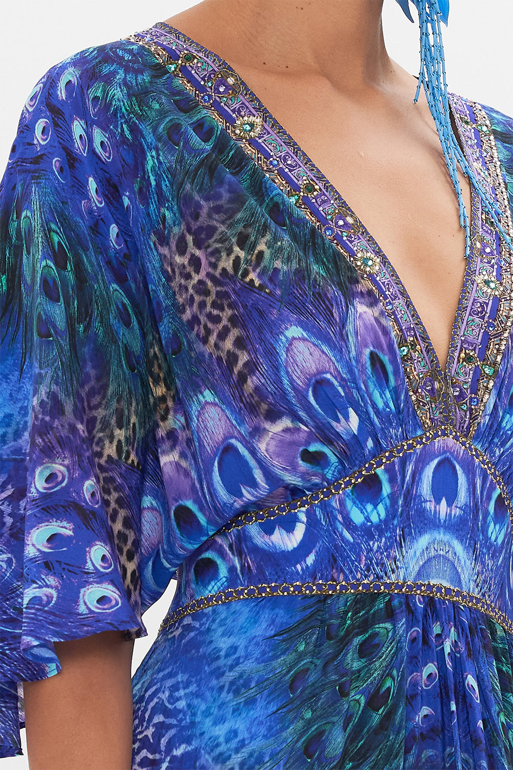 Detail view of model wearing CAMILLA silk ruffle dress in Peacock Rock print