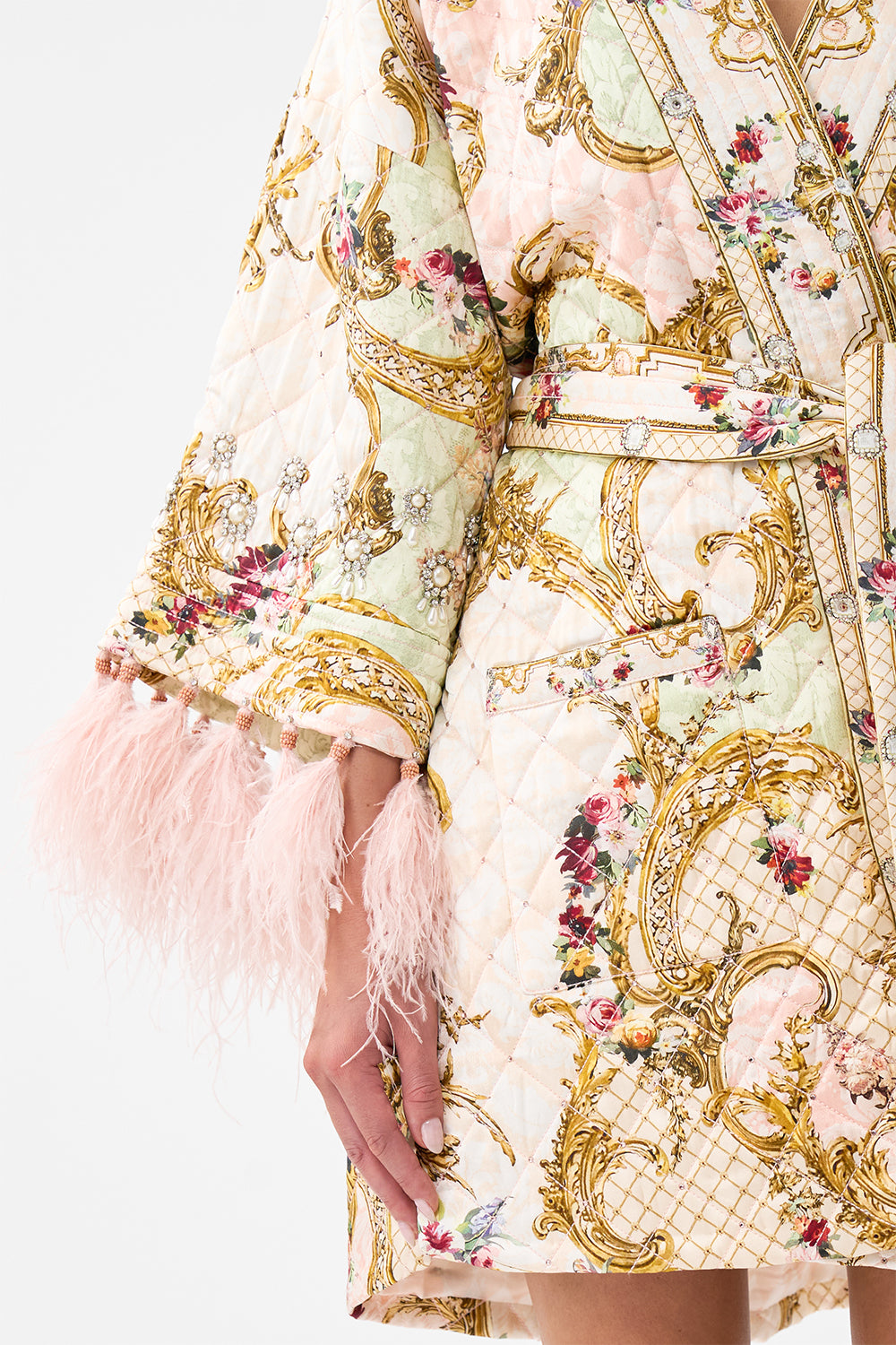 LAYER WITH TIE BELT AND FEATHERS THE QUEENS QUARTERS