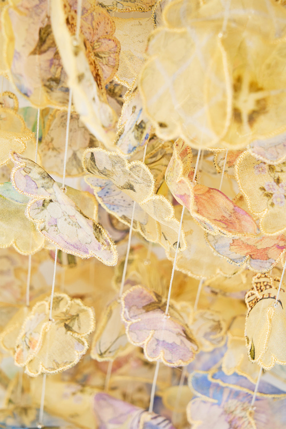 DRAWSTRING POUCH BAG WITH FLORAL FRINGE DARLING BUDS