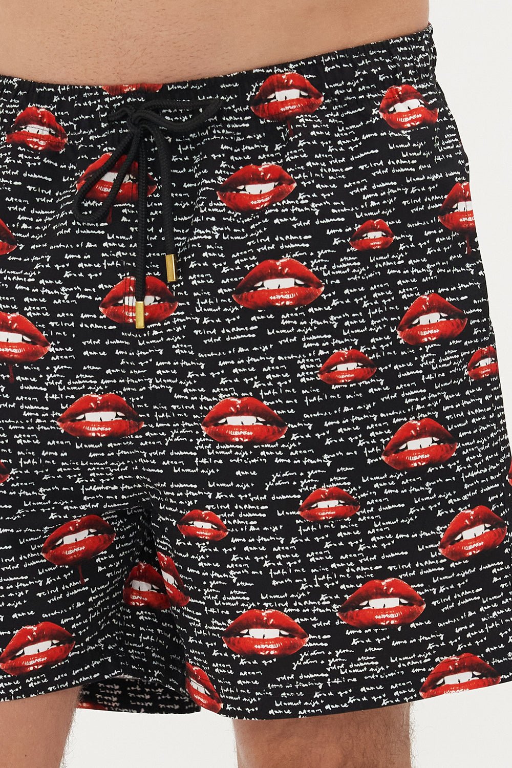 Detail view of model wearing Hotel Franks by CAMILLA mens elastic waist boardshorts in black Chaos Magic Print