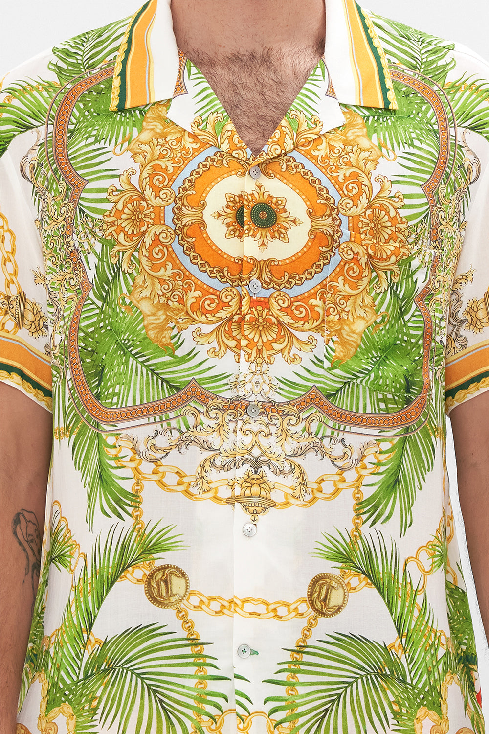 Crop view of model wearing Hotel Franks by CAMILLA mens white short sleeve shirt in My Sweet Devotion print