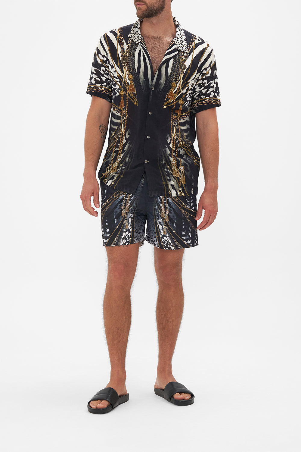 Front view of model wearing Hotel Franks by CAMILLA mens black and white short sleeve button through shirt in Untamed Royalty print