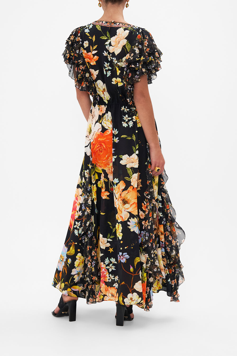 Back view of model wearing CAMILLA silk ruffle maxi dress in Secret History floral print