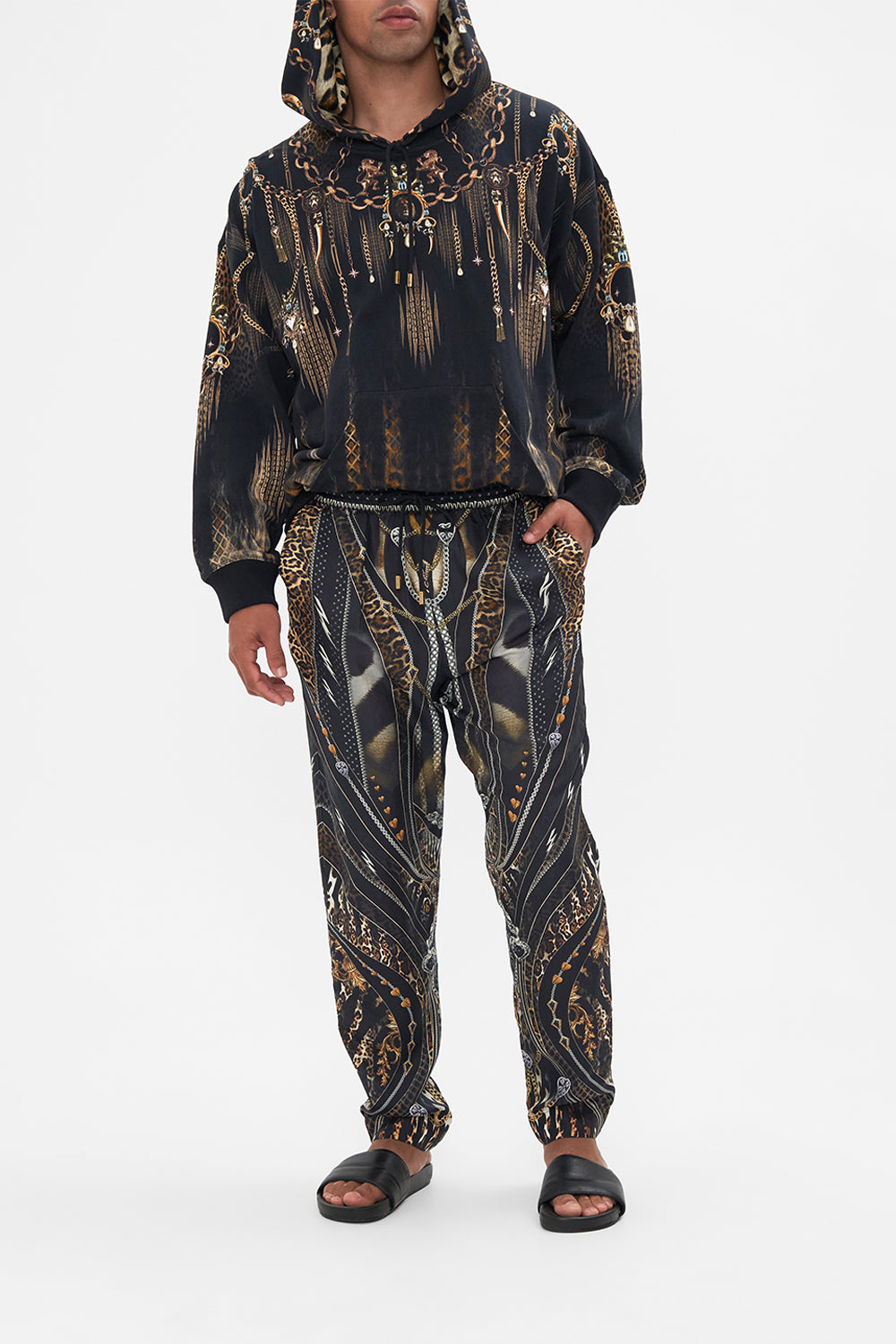 Front view of model wearing Hotel Franks by CAMILLA mens pants in Chaos In The Cosmos animal print 