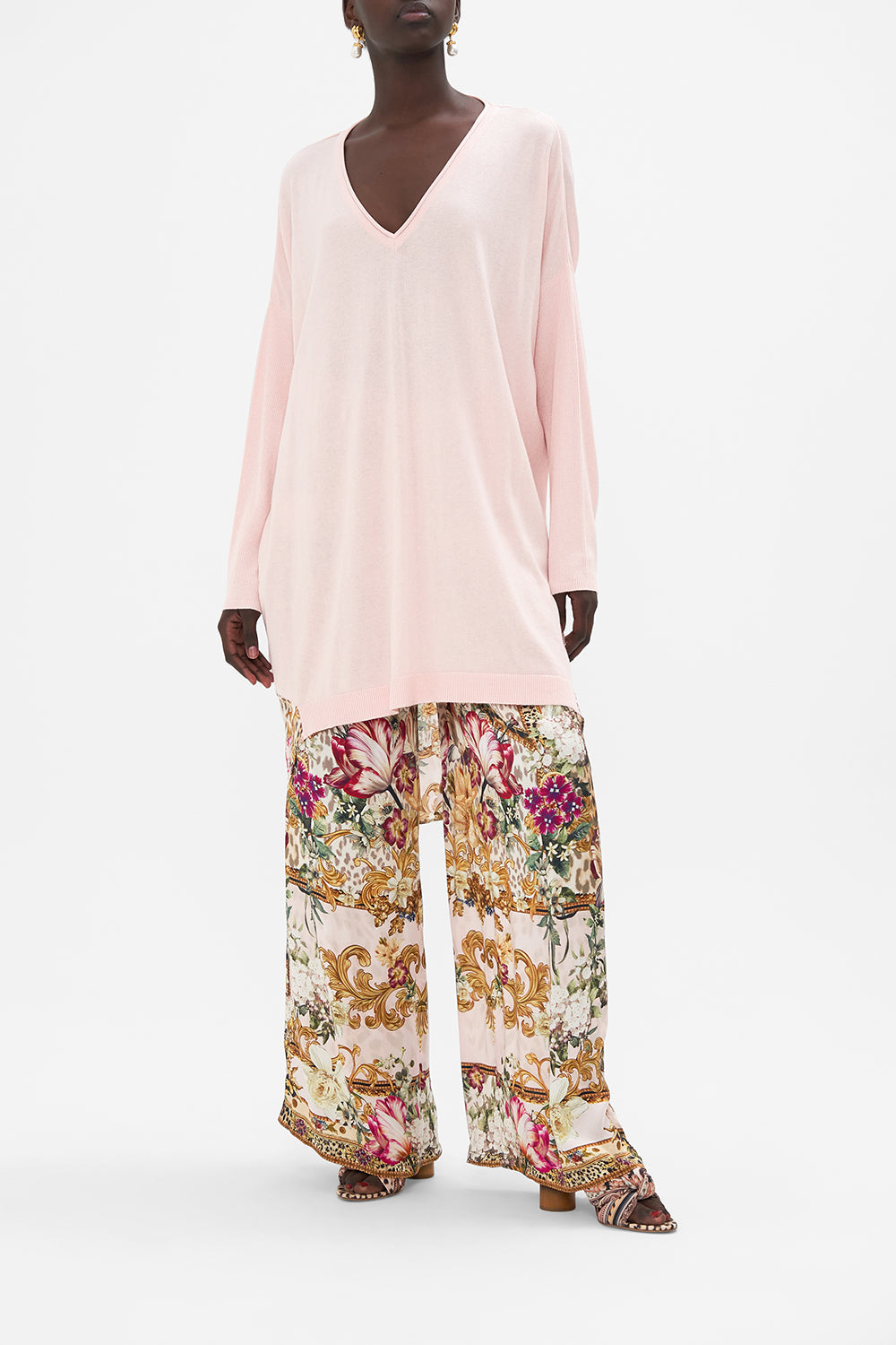 Front view of model wearing CAMILLA pink jumper Bambino Bliss print