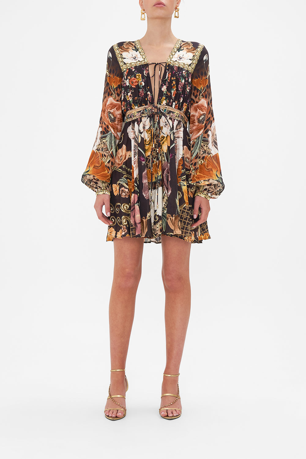 Front view of model wearing CAMILLA brown floral mini dress in Wave Your Wand print