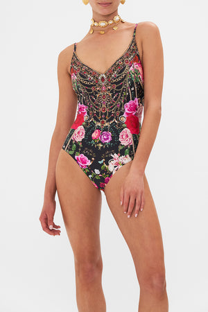 Crop view of model wearing CAMILLA underwire one piece swimsuit in Reservation For Love print 