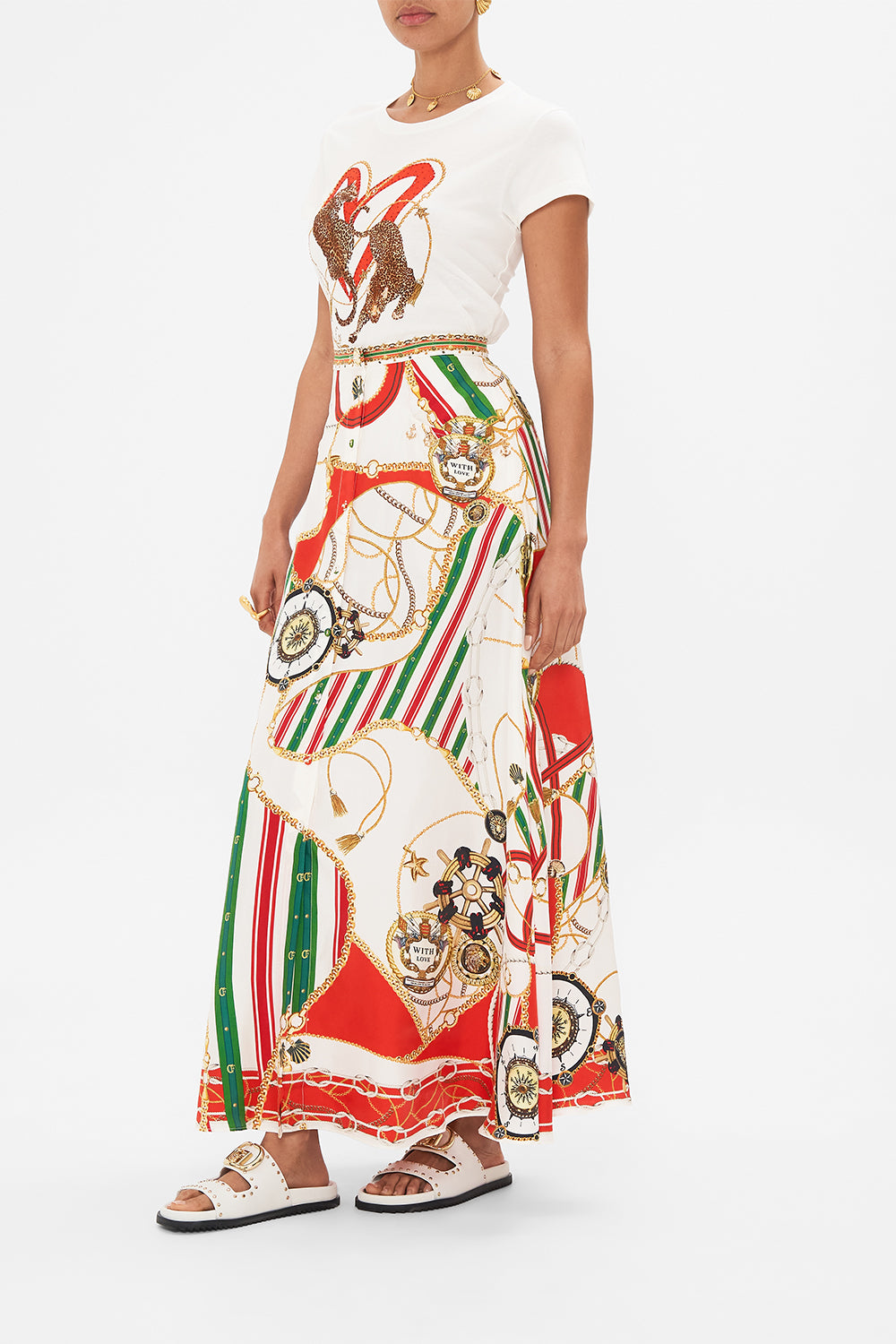 Crop view of model wearing CAMILLA button through skirt in Saluti Summertime print