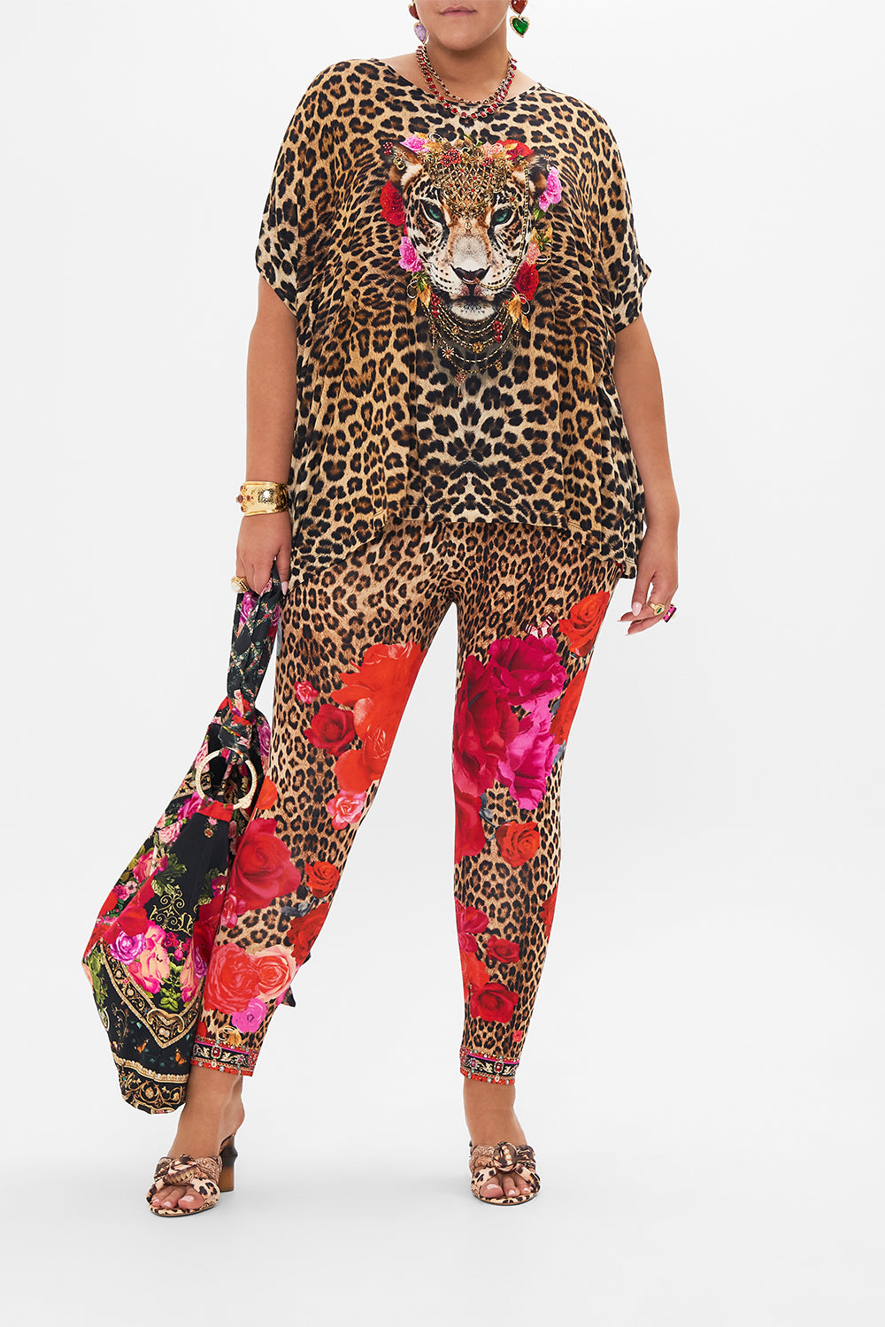 front view of curve model wearing CAMILLA plu size leopard print leggings in Heart Like A Wildflower print 