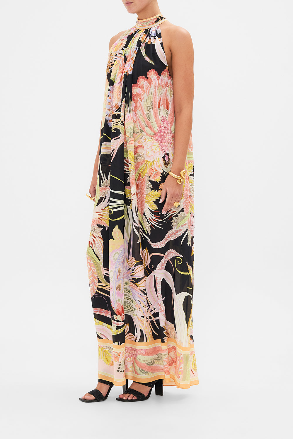 Side view of model wearing CAMILLA silk floral maxi dress in Lady of The Moon print