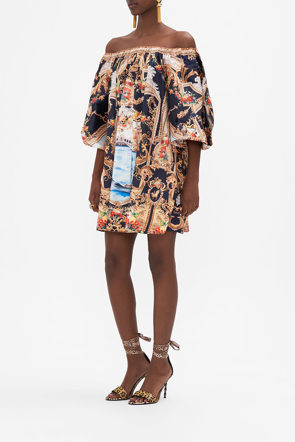 Side view of model wearing CAMILLA off the shoulder mini dress in Venice Vignette print