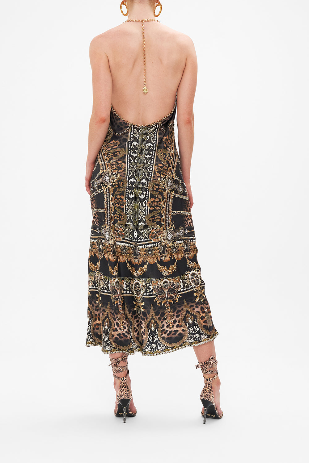 Back view of model wearing CAMILLA silk halter dress in Masked At Moonlight print