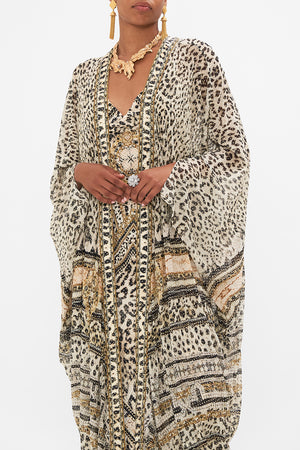 Crop view of model wearing CAMILLA luxury silk jacket in Mosaic Muse print
