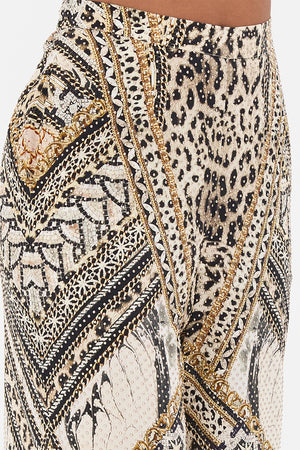 Detail view of model wearing CAMILLA silk animal print pants in Mosaic Muse 