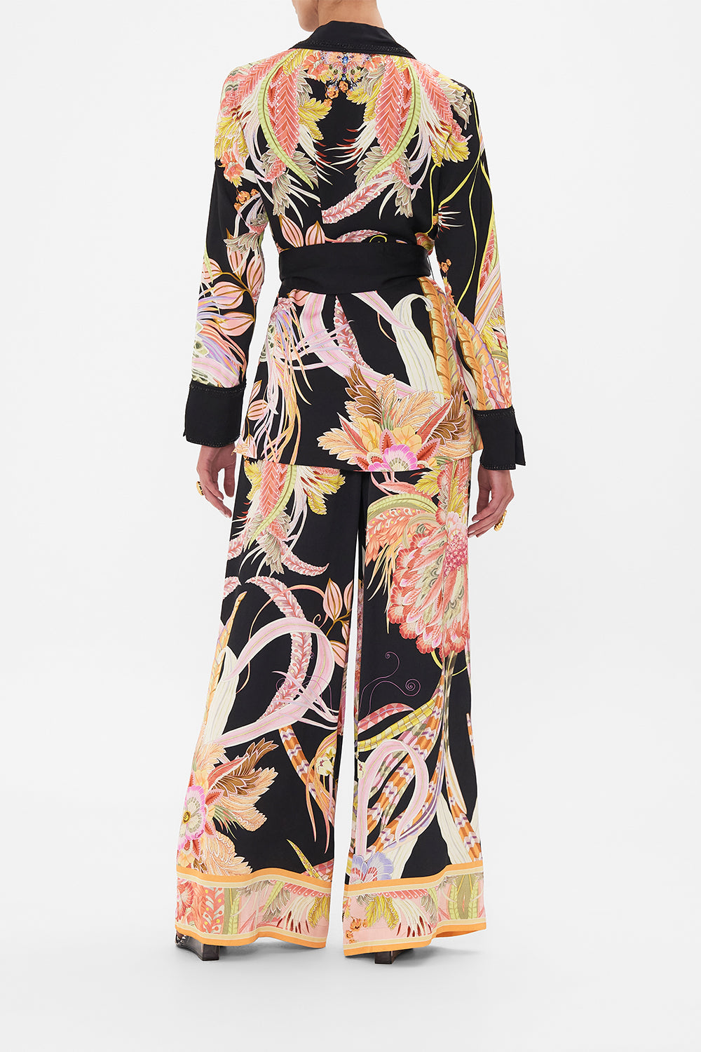 Back view of model wearing CAMILLA deisgner jacket in lady of The Moon Print