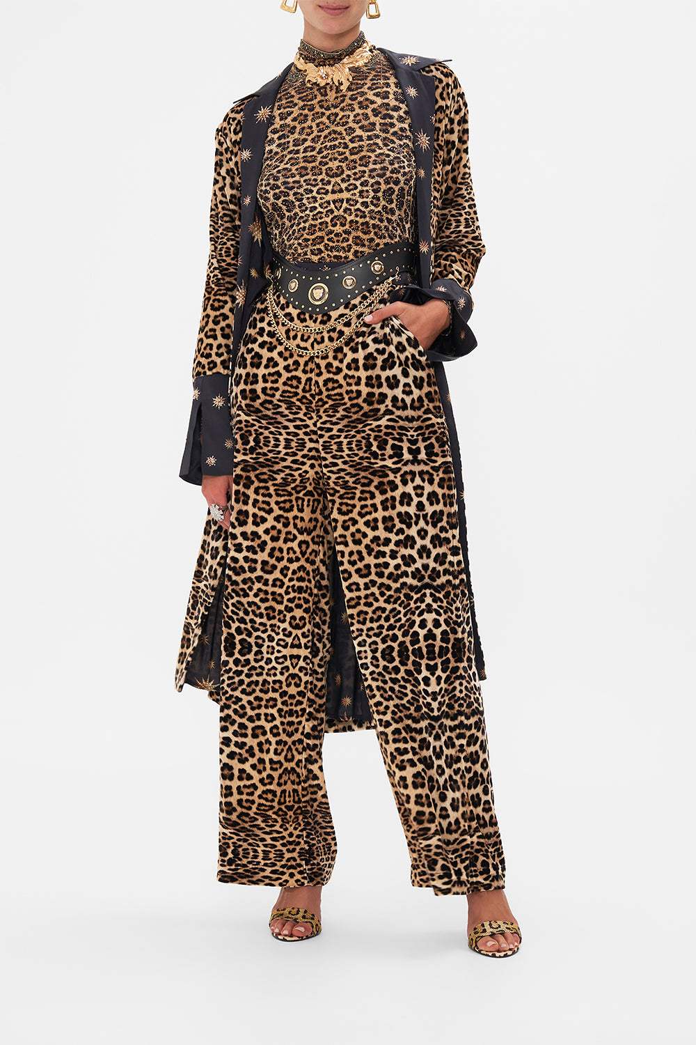 Crop view of model wearing CAMILLA silk pants in Soul of A Star Gazer print 