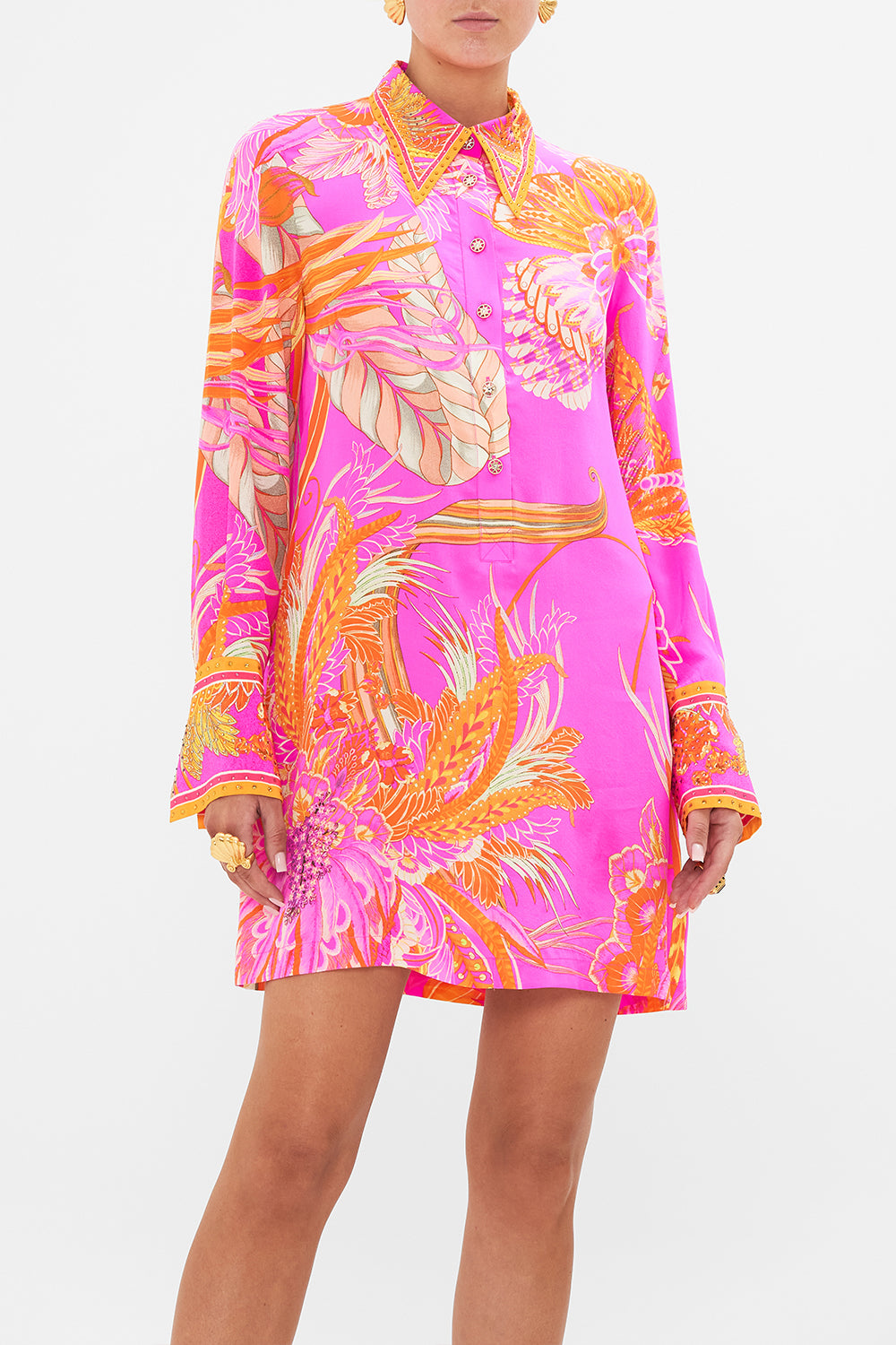 Crop view of model wearing CAMILLA silk shirt dress in A Heart That Flutters print