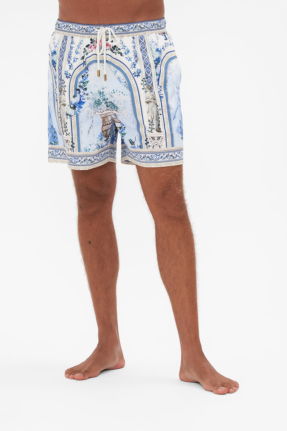 Crop view of model wearing Hotel Franks by CAMILLA mens boardshort in Season Of The Siren print 
