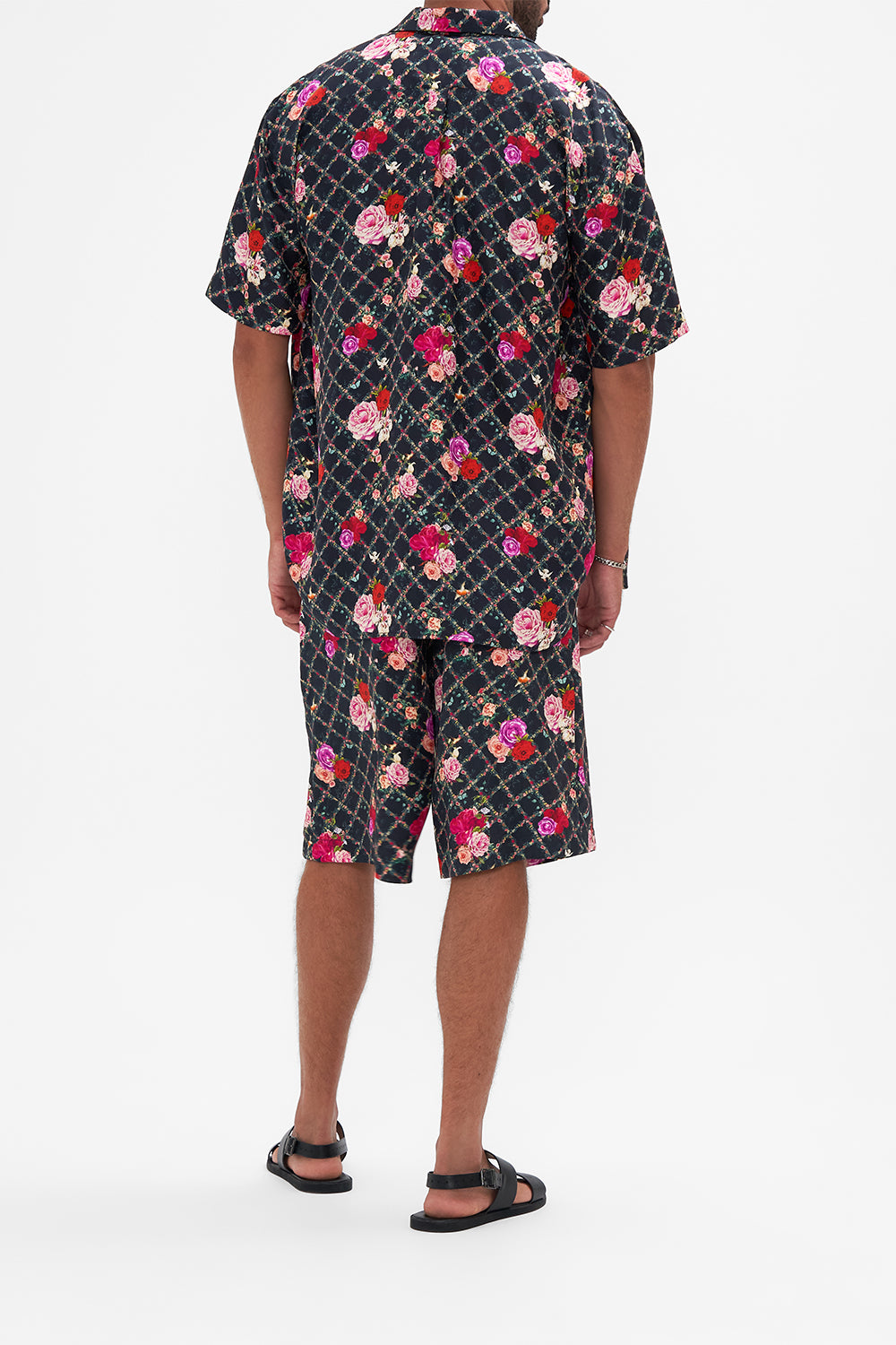 Back view of model wearing Hotel Franks By CAMILLA mens walkshort in Reservation For Love print 