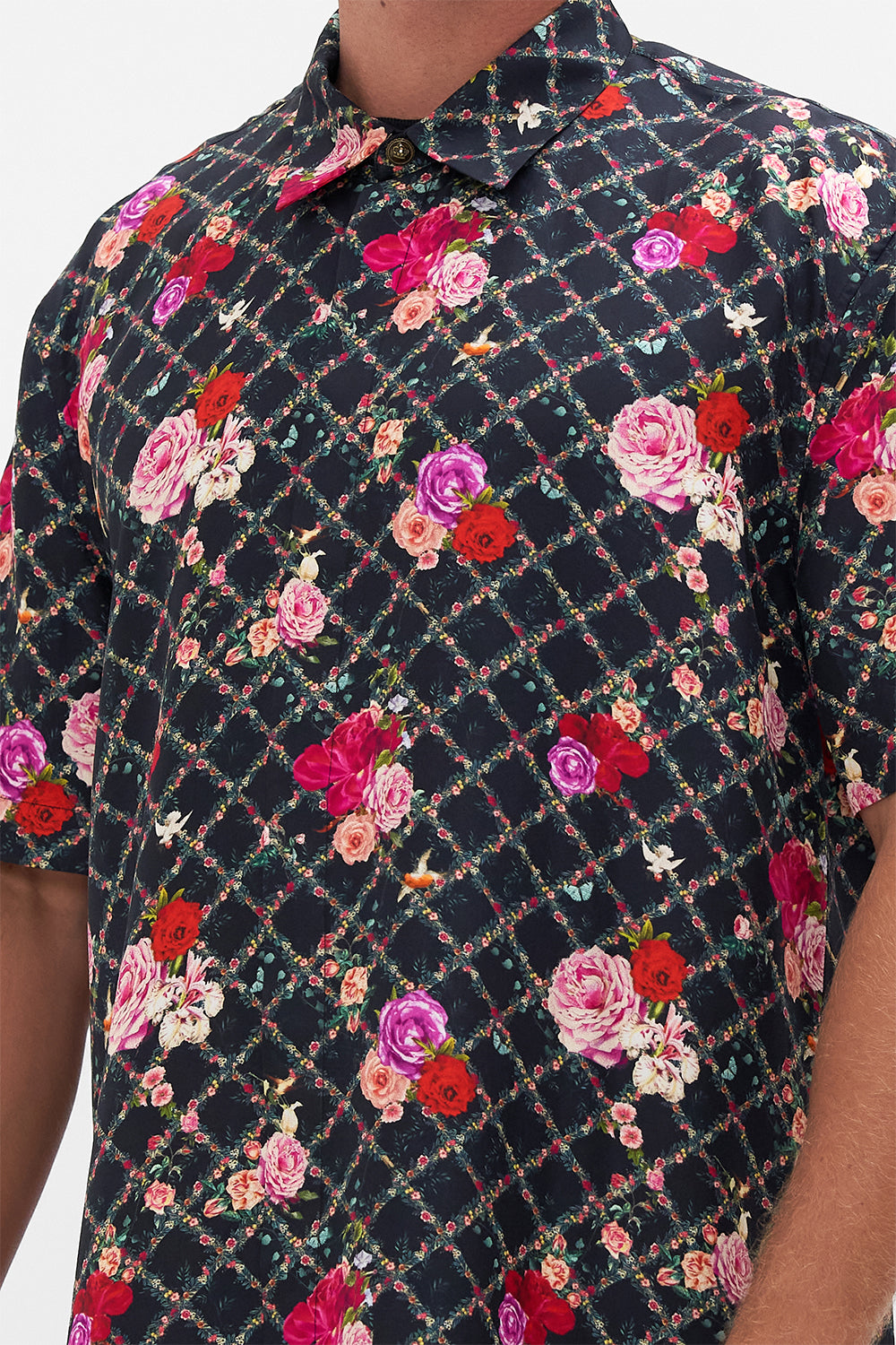 Detail view of model wearing CAMILLA silk short sleeve shirt in Reservation For Love print 