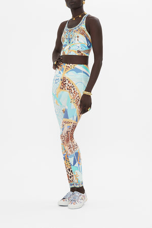 Side view of model waering CAMILLA activewear crop top in Sky Cheetah print